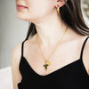 model with black clover black bulls necklace with 5 leaf clover