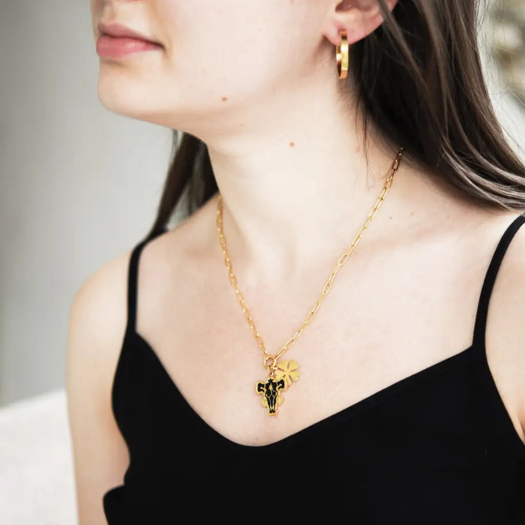 model with black clover black bulls necklace with 5 leaf clover