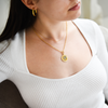 model wearing gold and silver fairy tail guild necklace