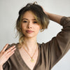 model wearing fairy tail necklace