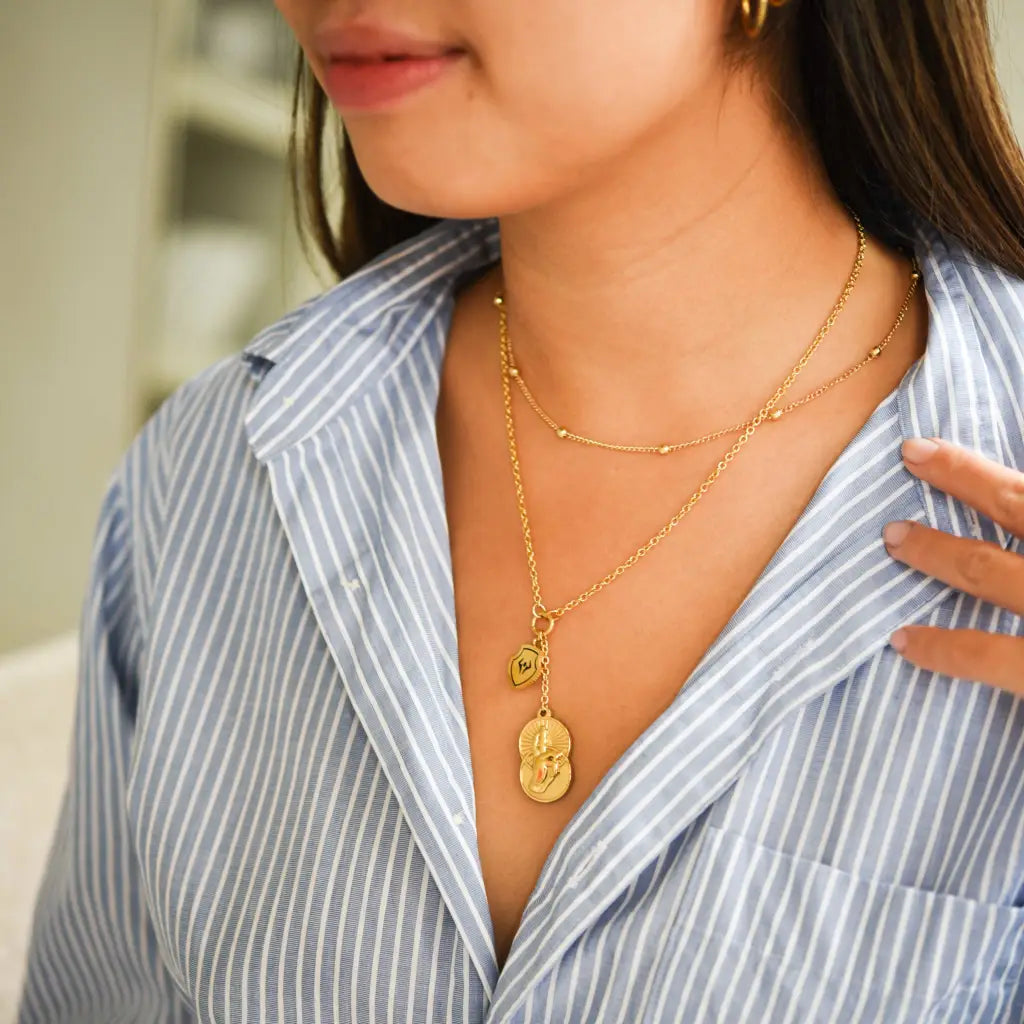 model wearing jujutsu kaisen gojo's infinite void necklace
