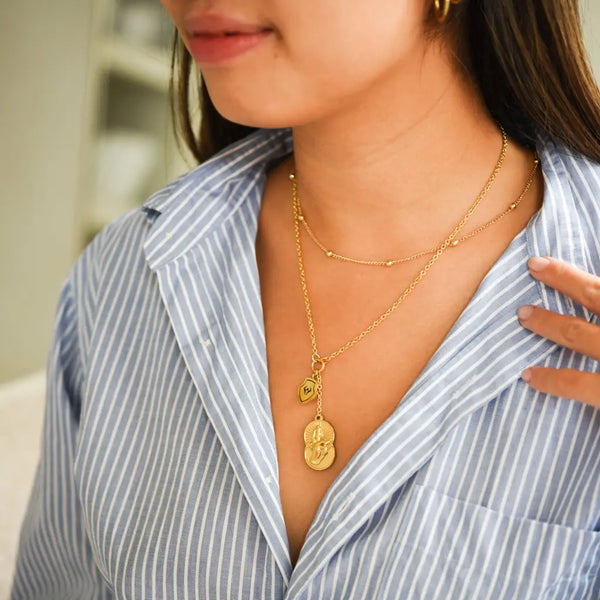 model wearing jujutsu kaisen gojo's infinite void necklace