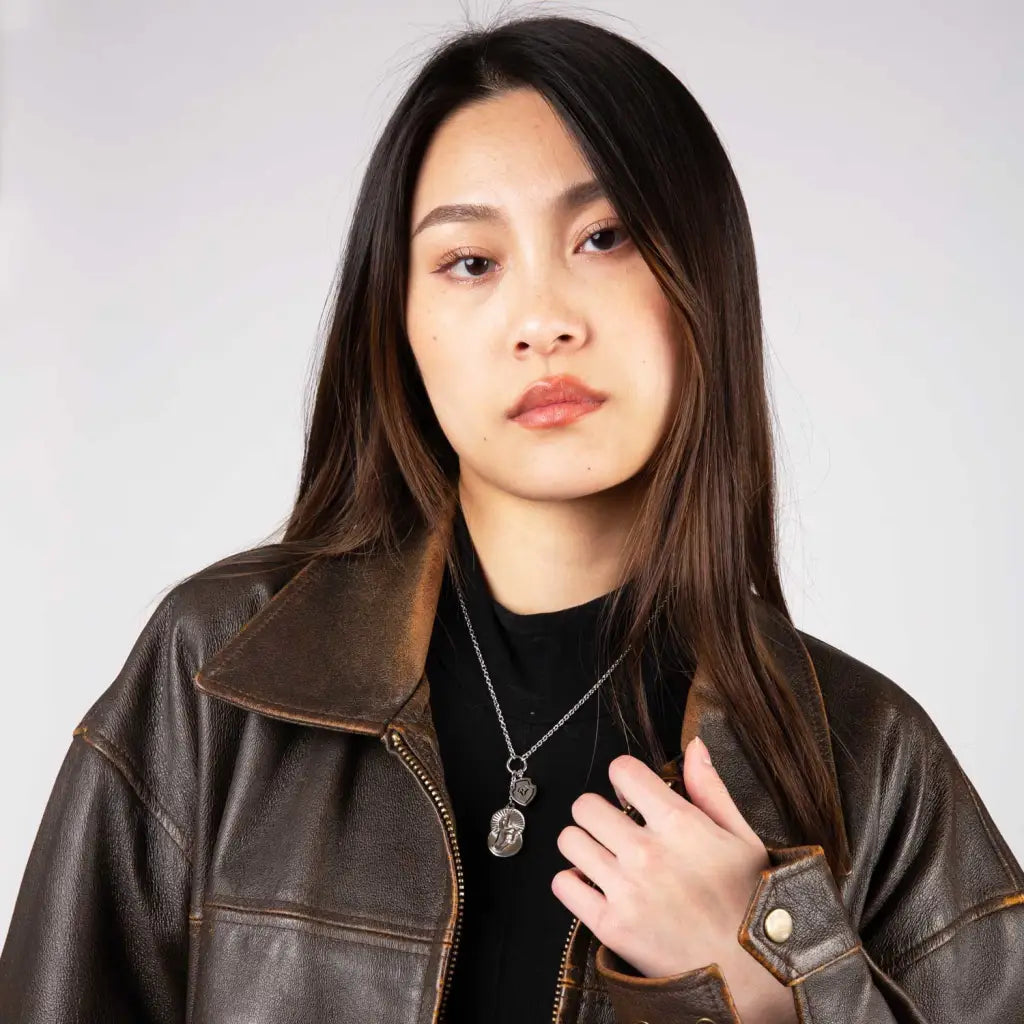 model wearing silver gojo's infinite void necklace