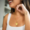 model wearing haikyuu karasuno crows gold necklace