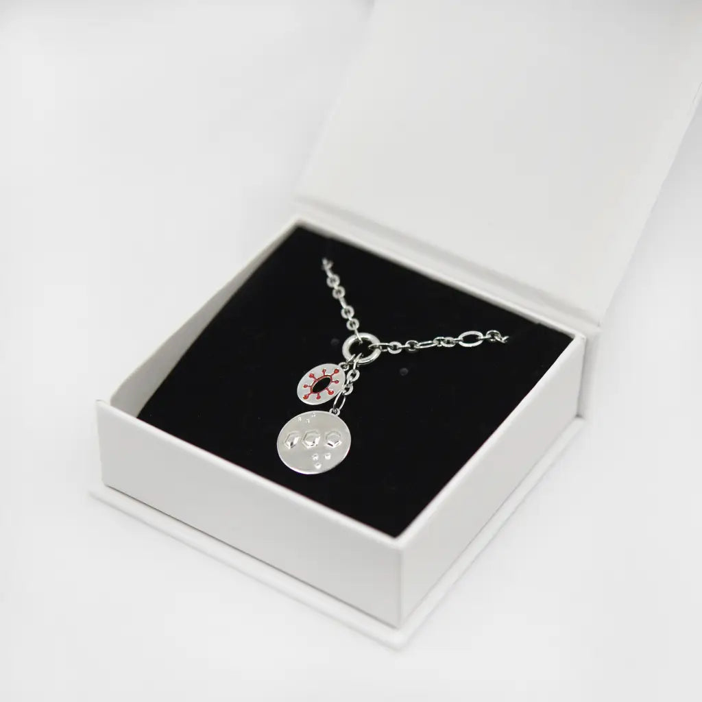 tengen uzui flashy necklace in silver in jewelry box